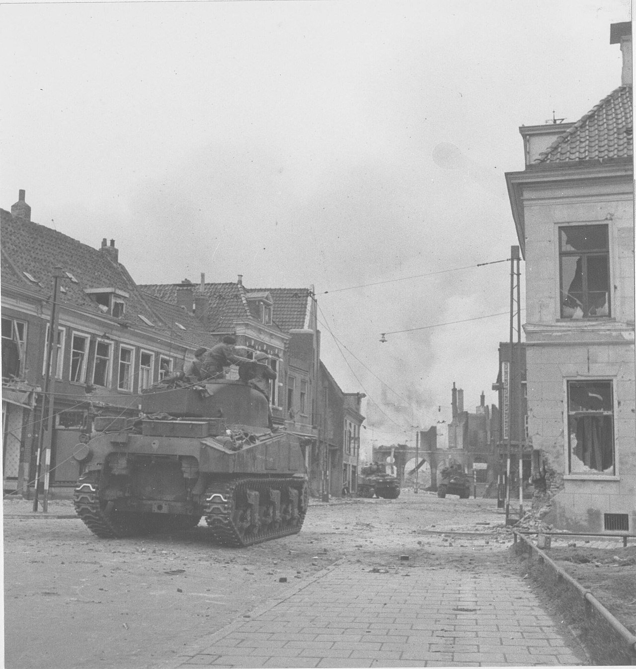 Canadian tank firing at buildings on the rademark in Groningen during the Battle of Groningen.